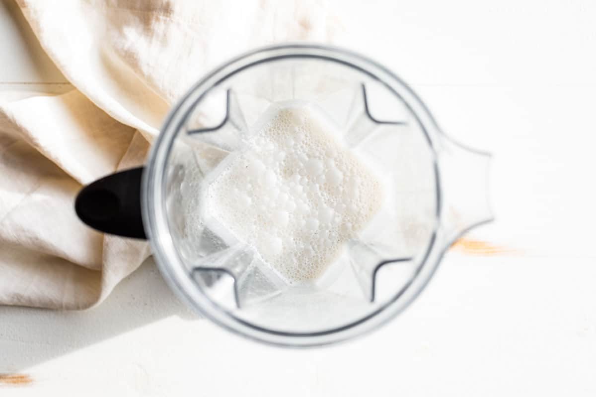 The creamy coconut mixture for the chia pudding blended up in a blender.