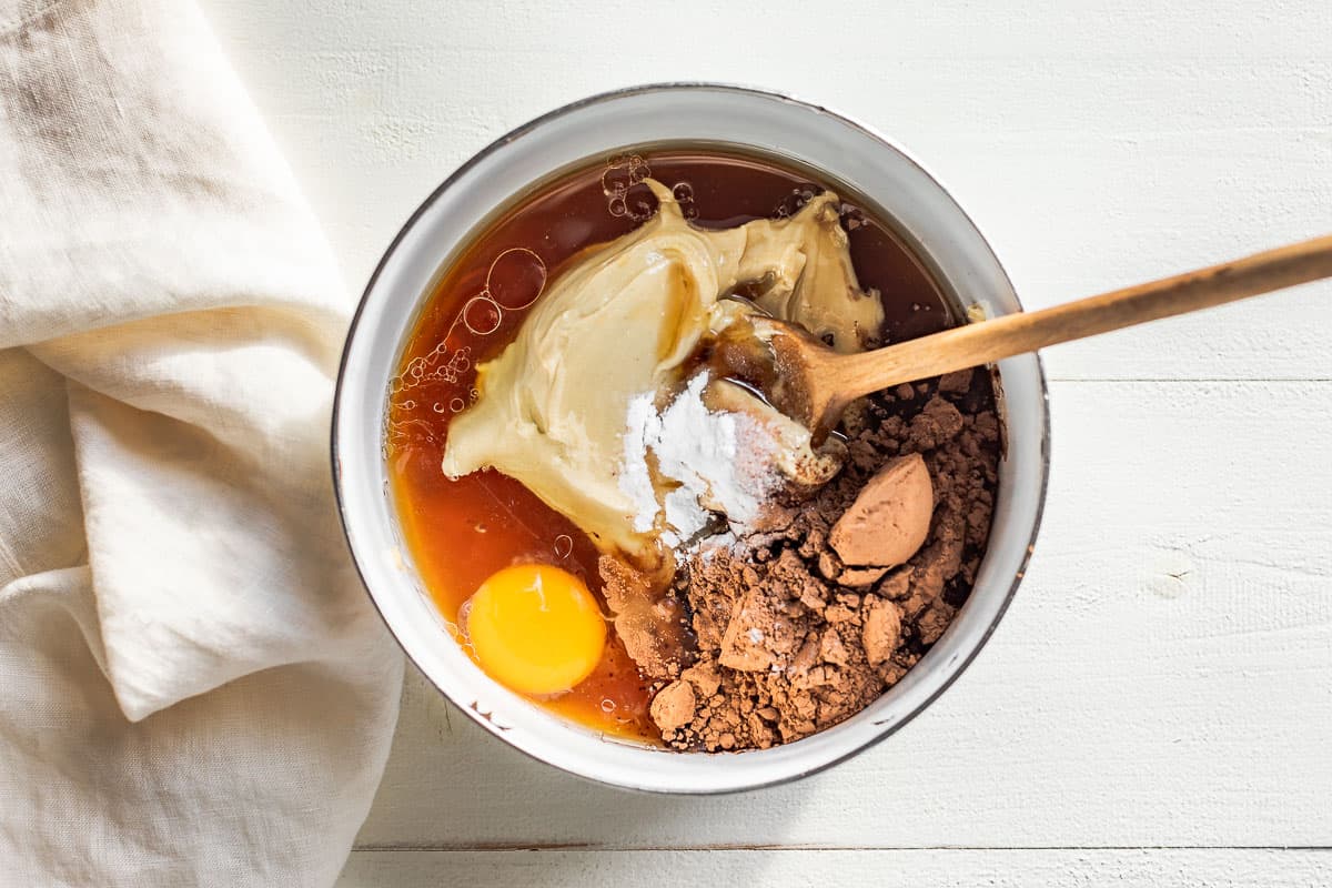 All the ingredients for the flourless brownies added to a mixing bowl.