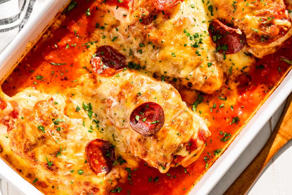 Straight down view of the baking dish of Pizza Chicken on a diagonal.