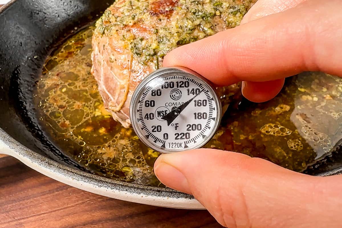 Instant read thermometer inserted into the pork sirloin roast.