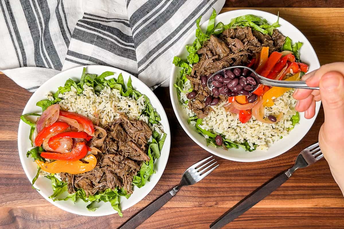 Adding fajita veggies and black beans to the burrito bowls.