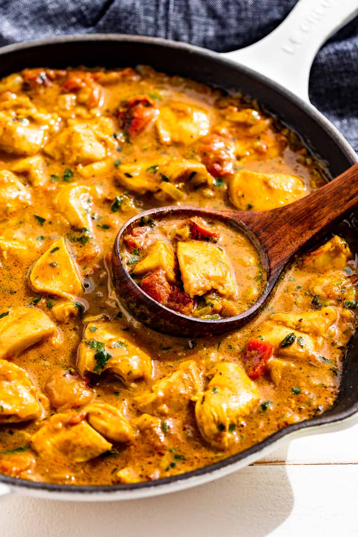 Side view of Easy Chicken Curry in a white skillet.