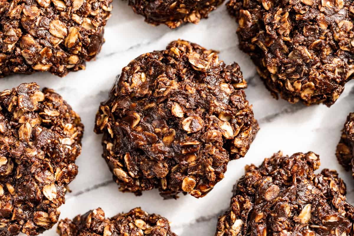 Portioned out Healthy No Bake Cookies on a marble background.