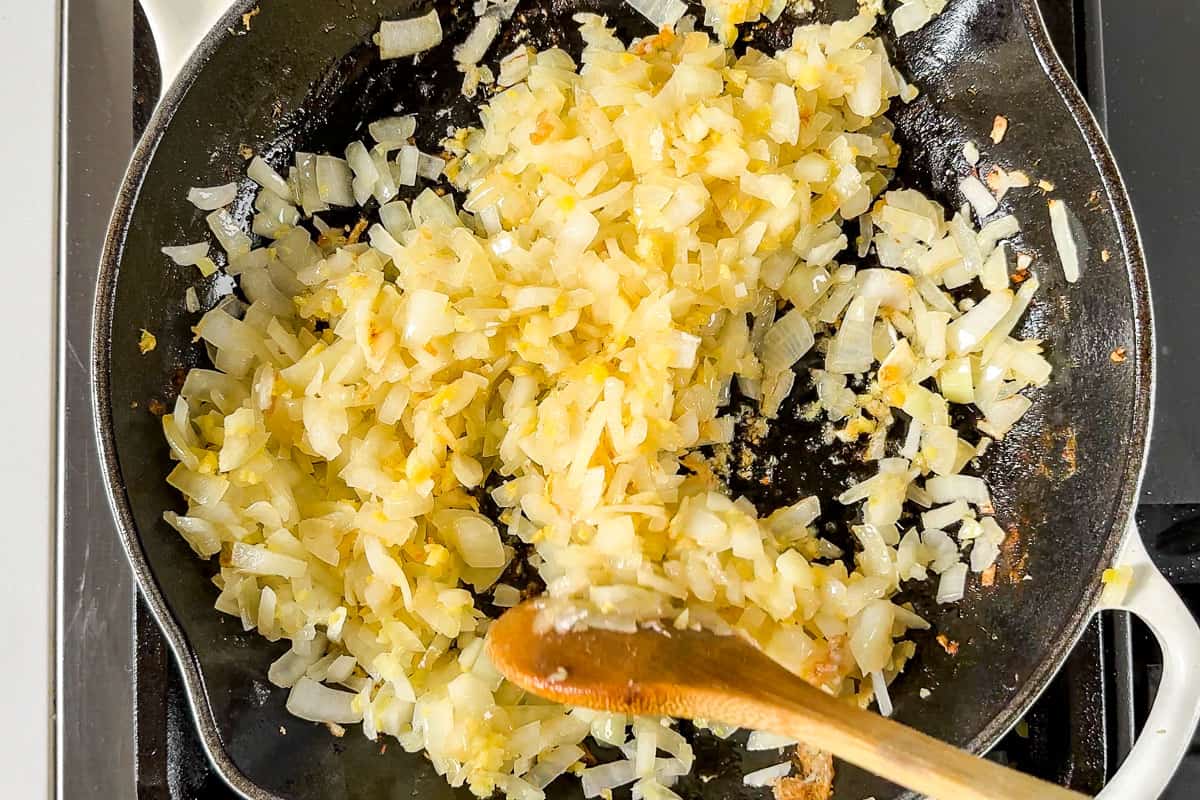 Cooking onion, garlic, ginger in a cast iron skillet.