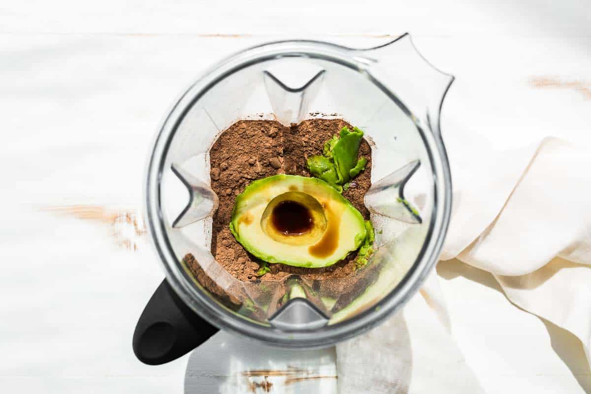 Ingredients for the chocolate avocado ice cream in a blender container.