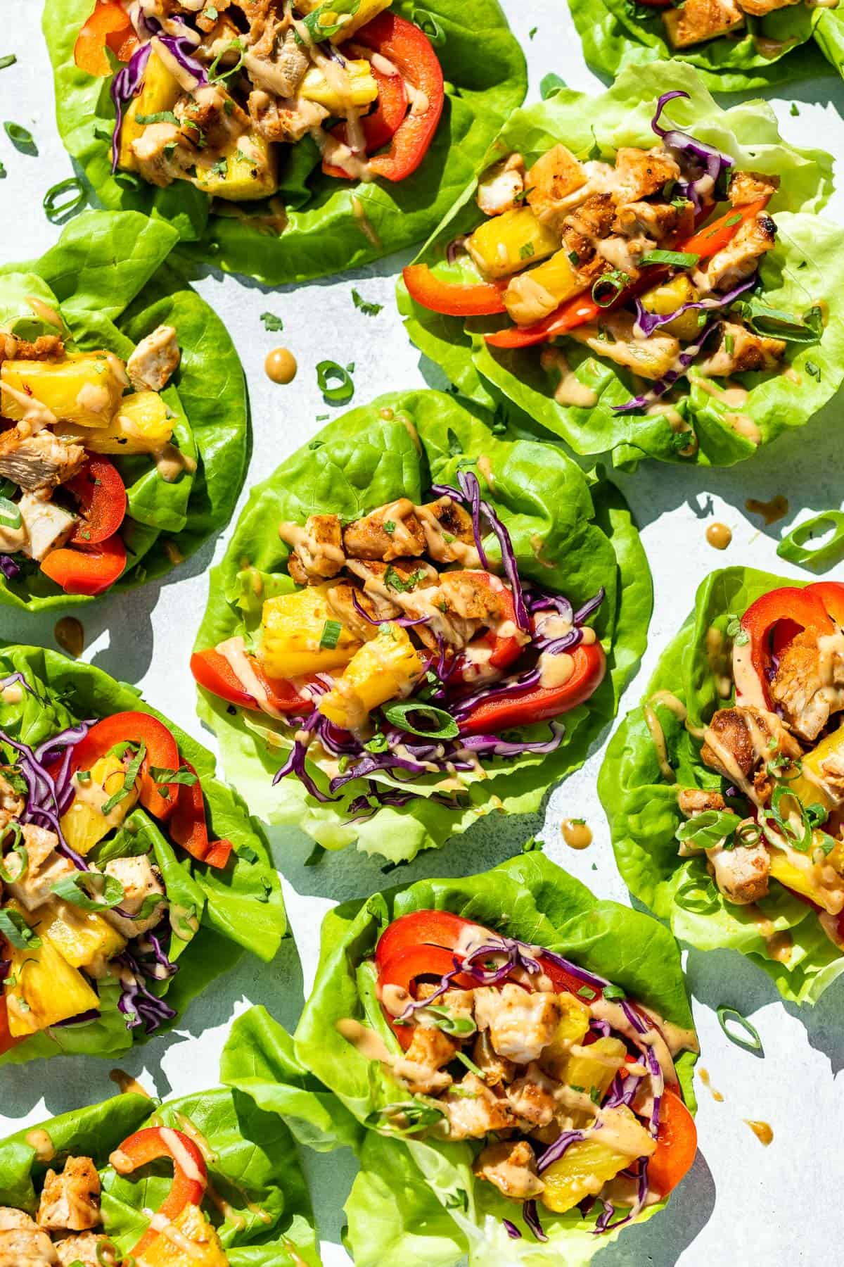 Nine Thai Lettuce Wraps on a blue background.