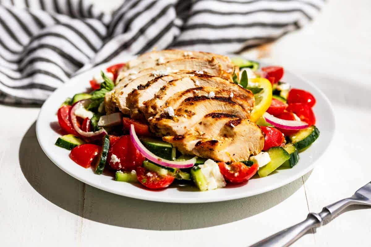 Greek Chicken grilled, sliced and placed over the top of Greek Salad.