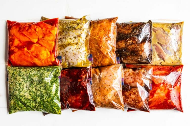 All ten chicken marinades in Ziplock bags arranged in two rows in a white background.