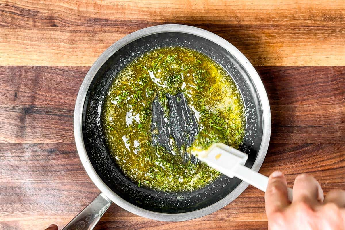 Melting honey and butter together in a small fry pan.