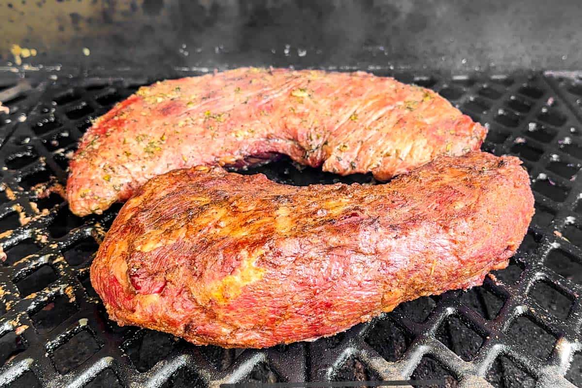 Marinated tri tips on a smoker grill.