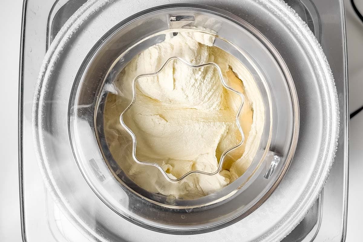 Freezing the ice cream in an ice cream maker.