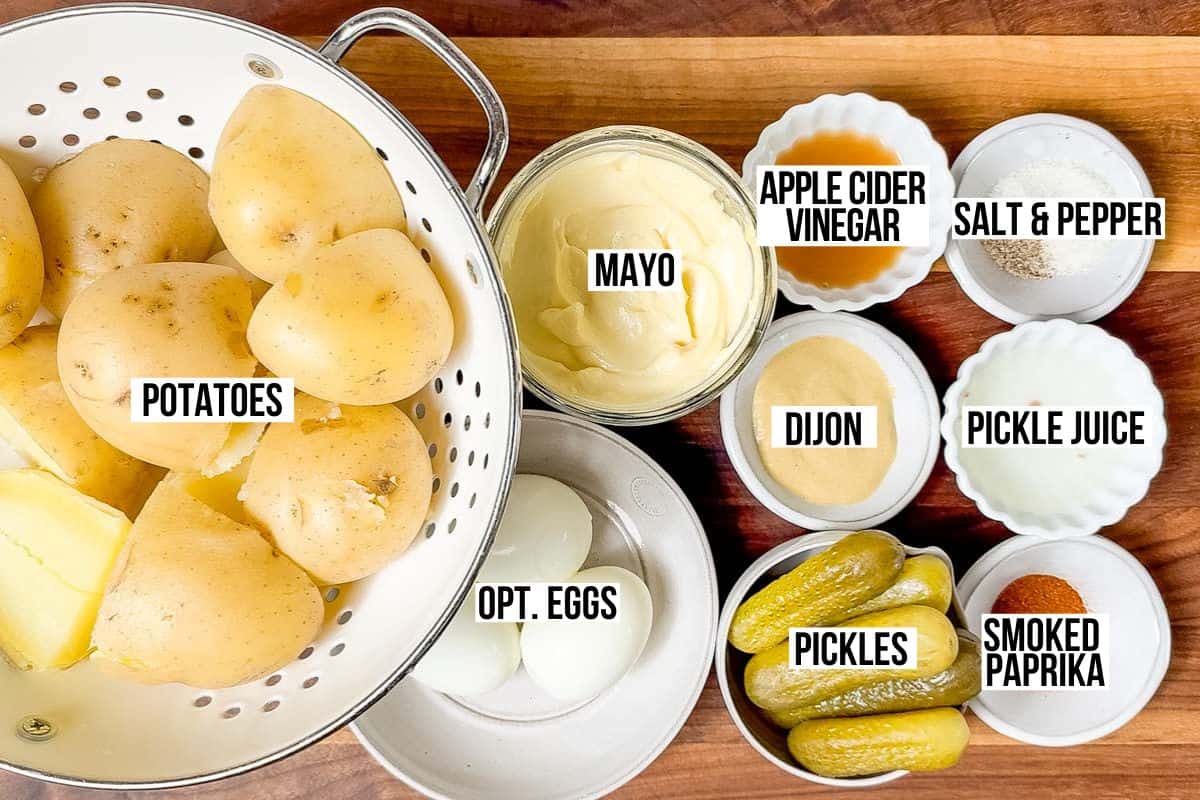 Potatoes, mayonnaise, apple cider vinegar, pickles, smoked paprika, pickle juice, Dijon mustard, salt, pepper, and hard boiled eggs.