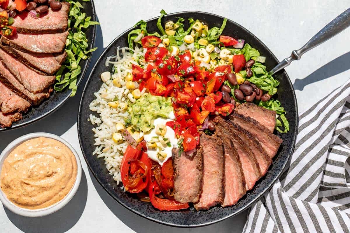 Steak burrito bowls with a side of chipotle ranch.